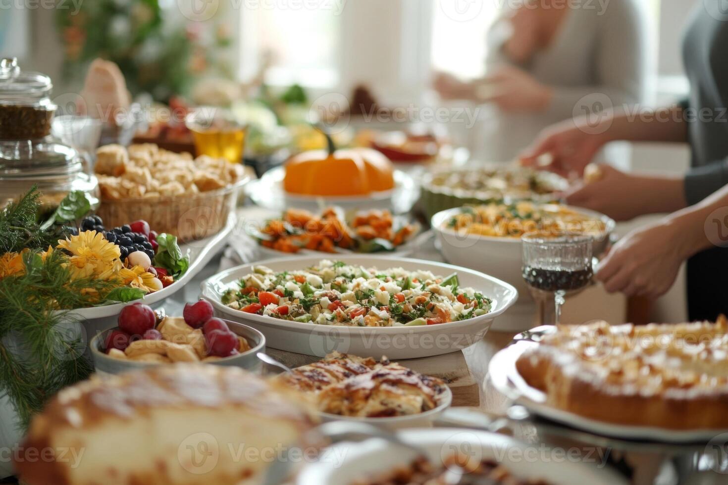 A Table Spread with Various Dishes and Desserts at a Gathering photo