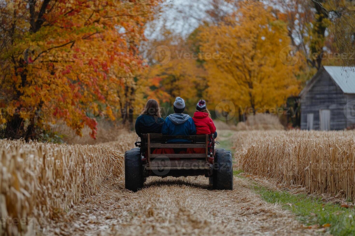 Family Riding in a Wagon Through a Rural Autumn Landscape photo