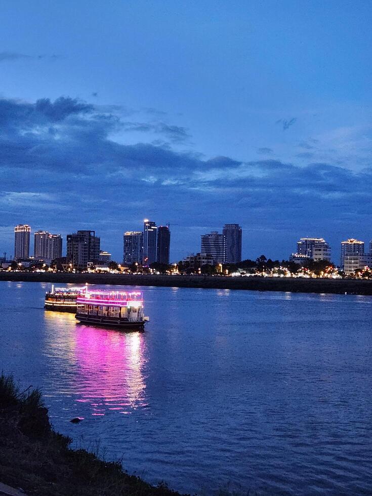 A river with a boat in the water at dusk photo