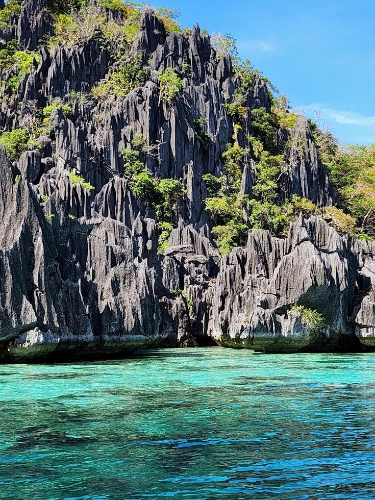 The rock formations in the water are very beautiful photo
