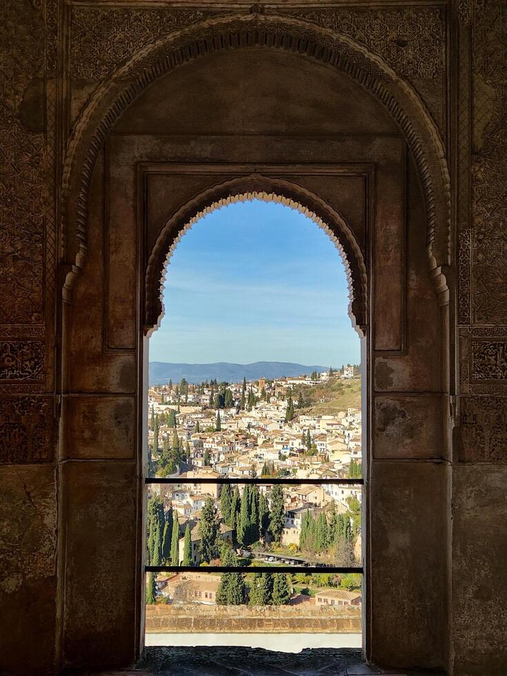 A view of the city through an arched window photo