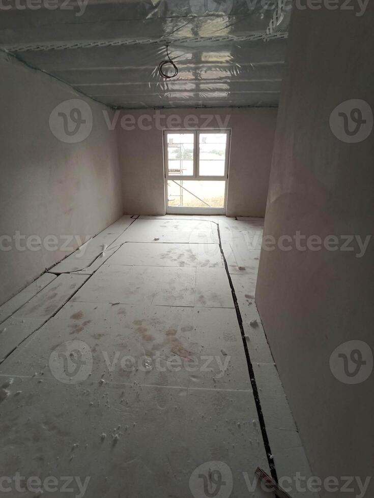 An Empty Room That is Currently Under Construction, Bathed in Abundant Natural Light photo