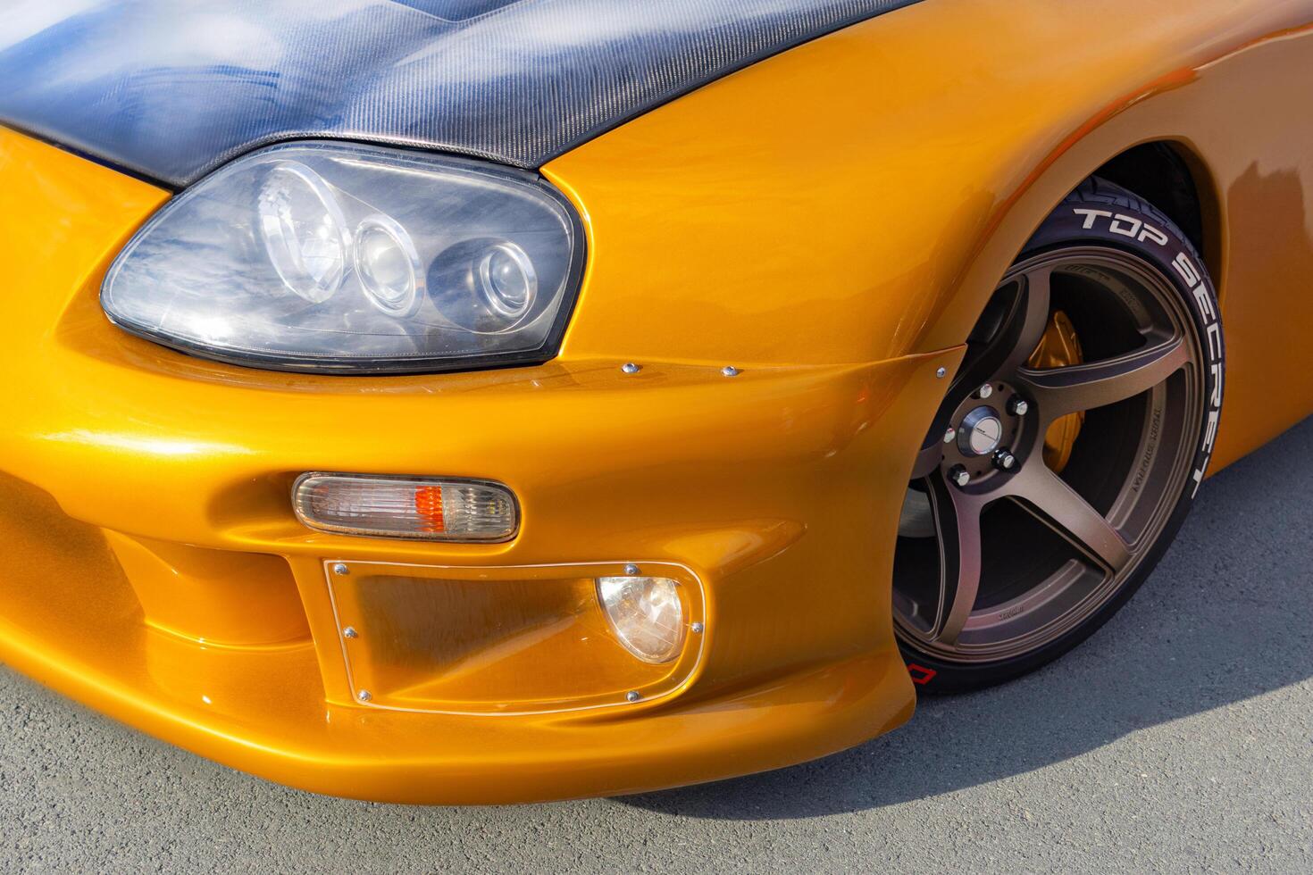 15.09.2024. Novosibirsk, Midday, Top Secret Performance Orange Toyota Supra A80 close up photo