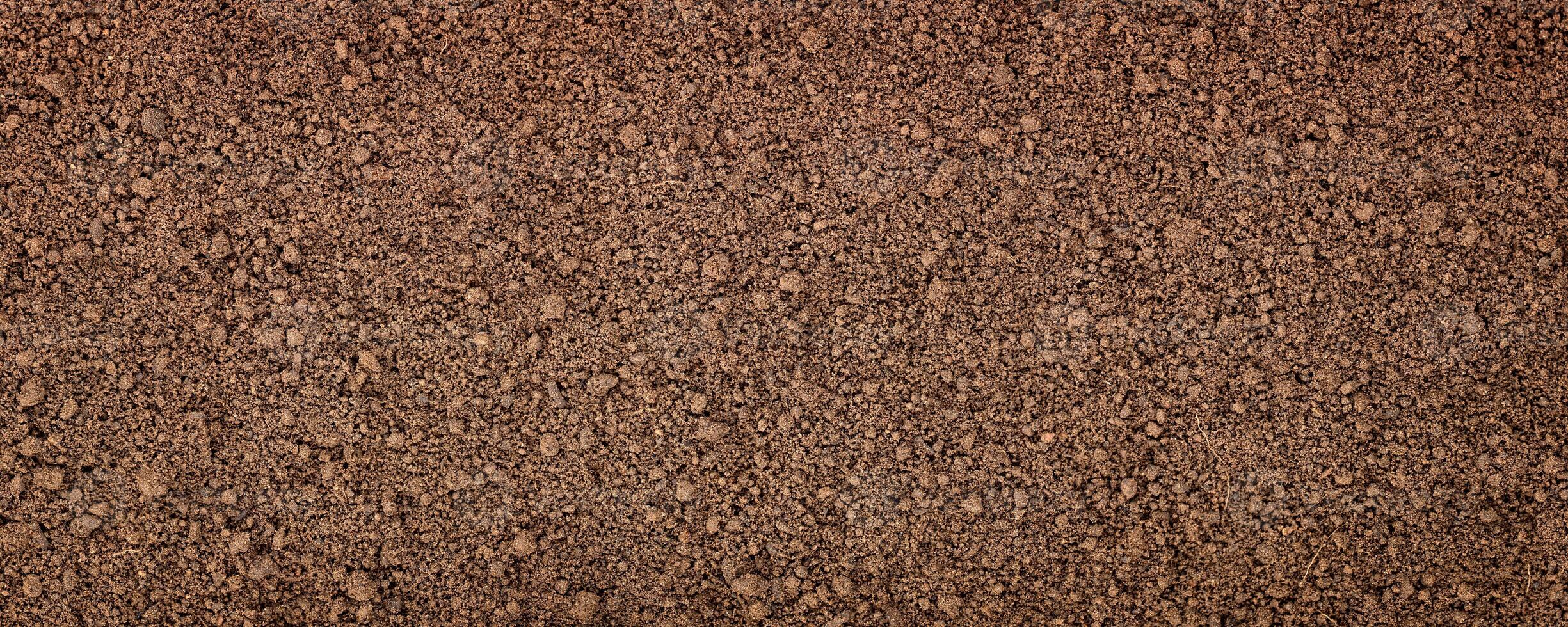 soil surface closeup, earth texture, ground background photo