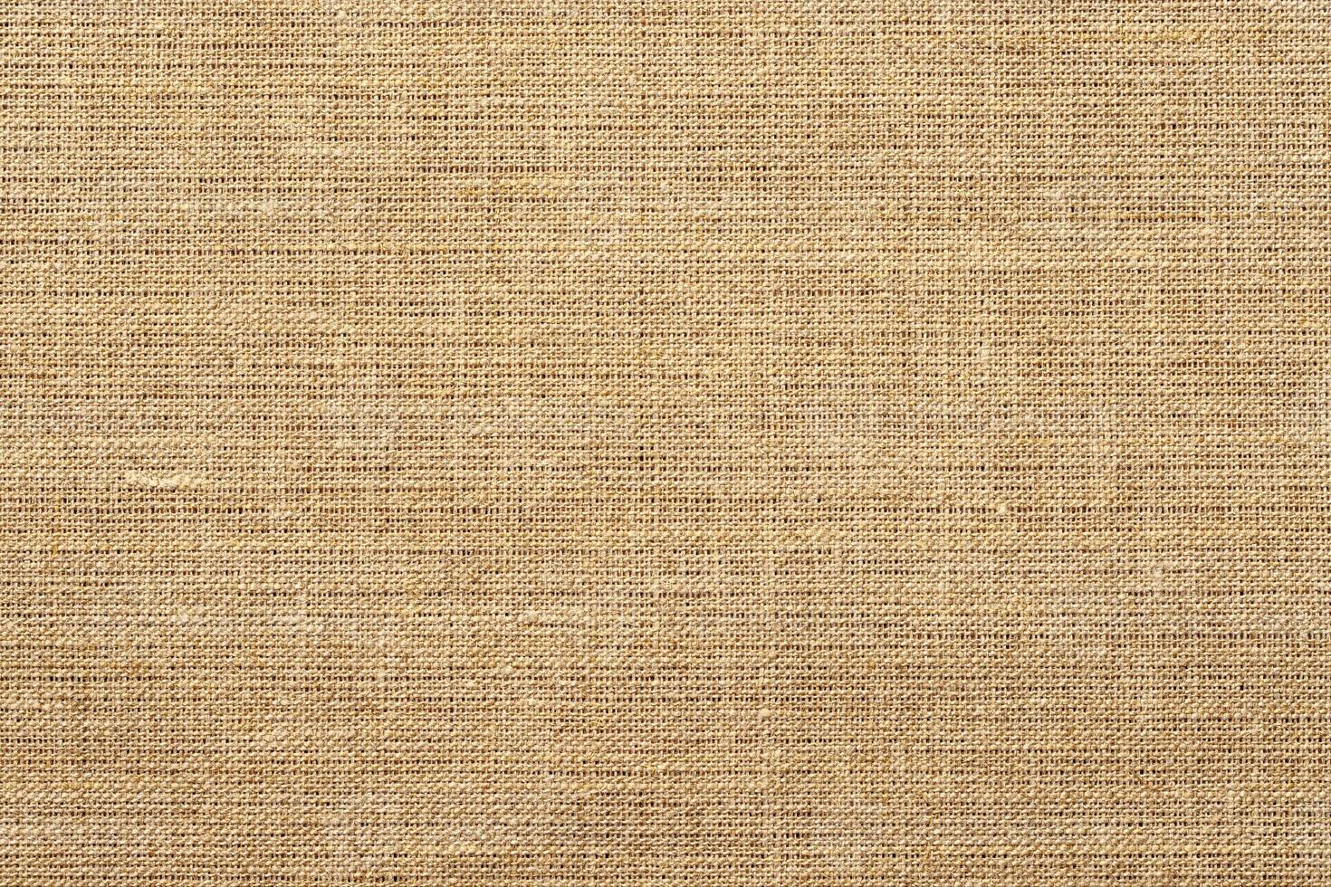 light brown burlap fabric texture. natural grunge background photo