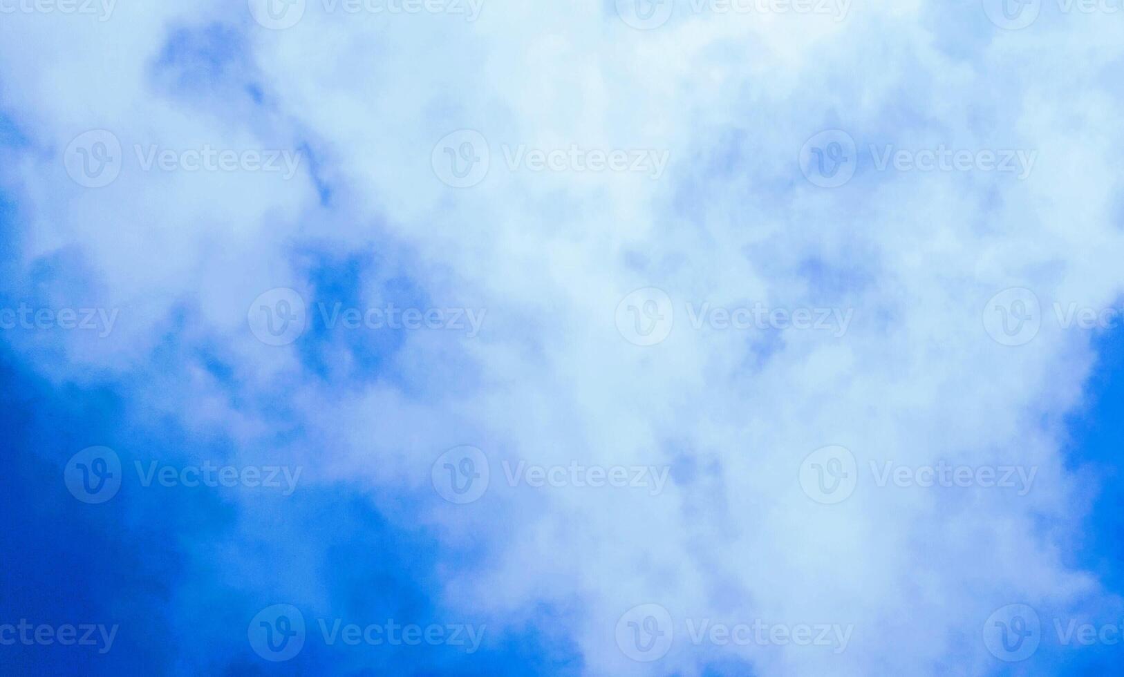 A plane flying through the air with a cloud in the background photo