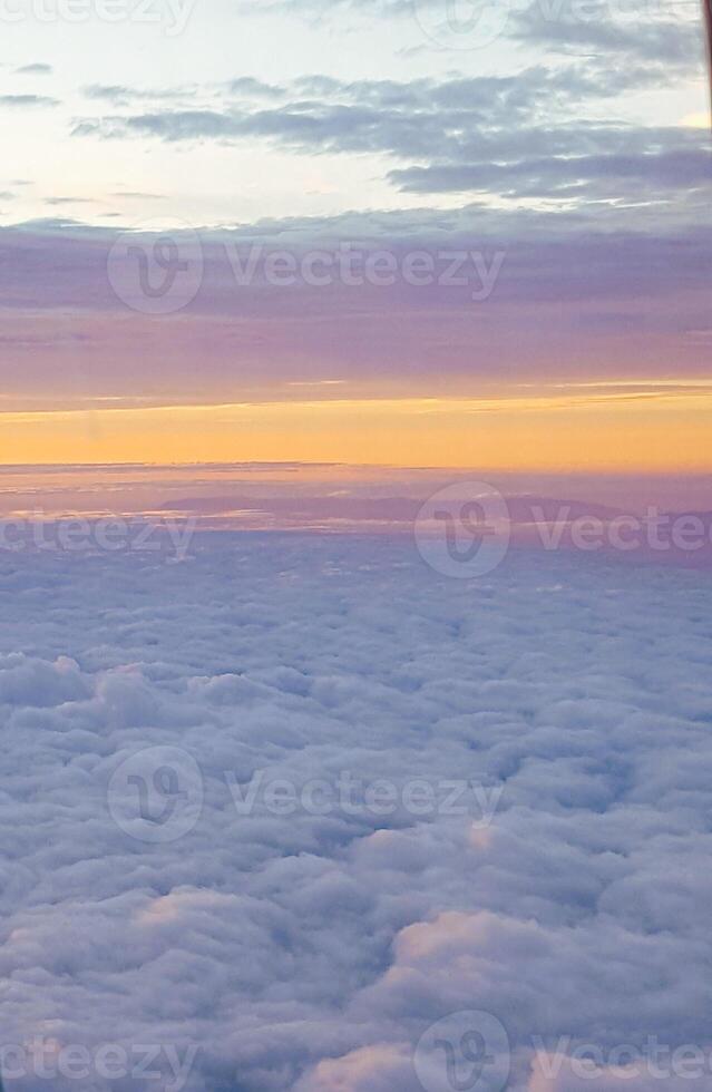 A view of the clouds from an airplane window photo