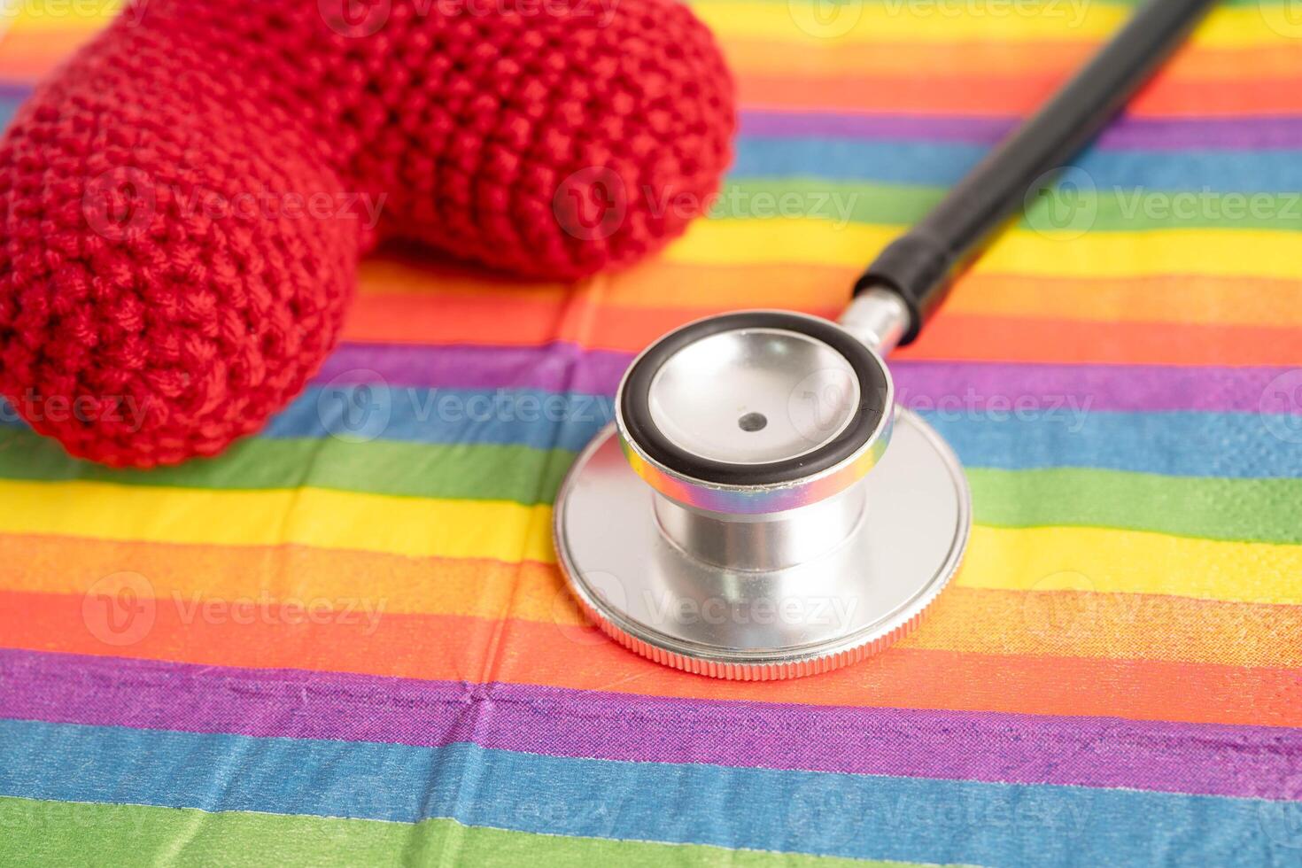 LGBT symbol, Stethoscope with red heart on rainbow flag, rights and gender equality, LGBT Pride Month in June. photo