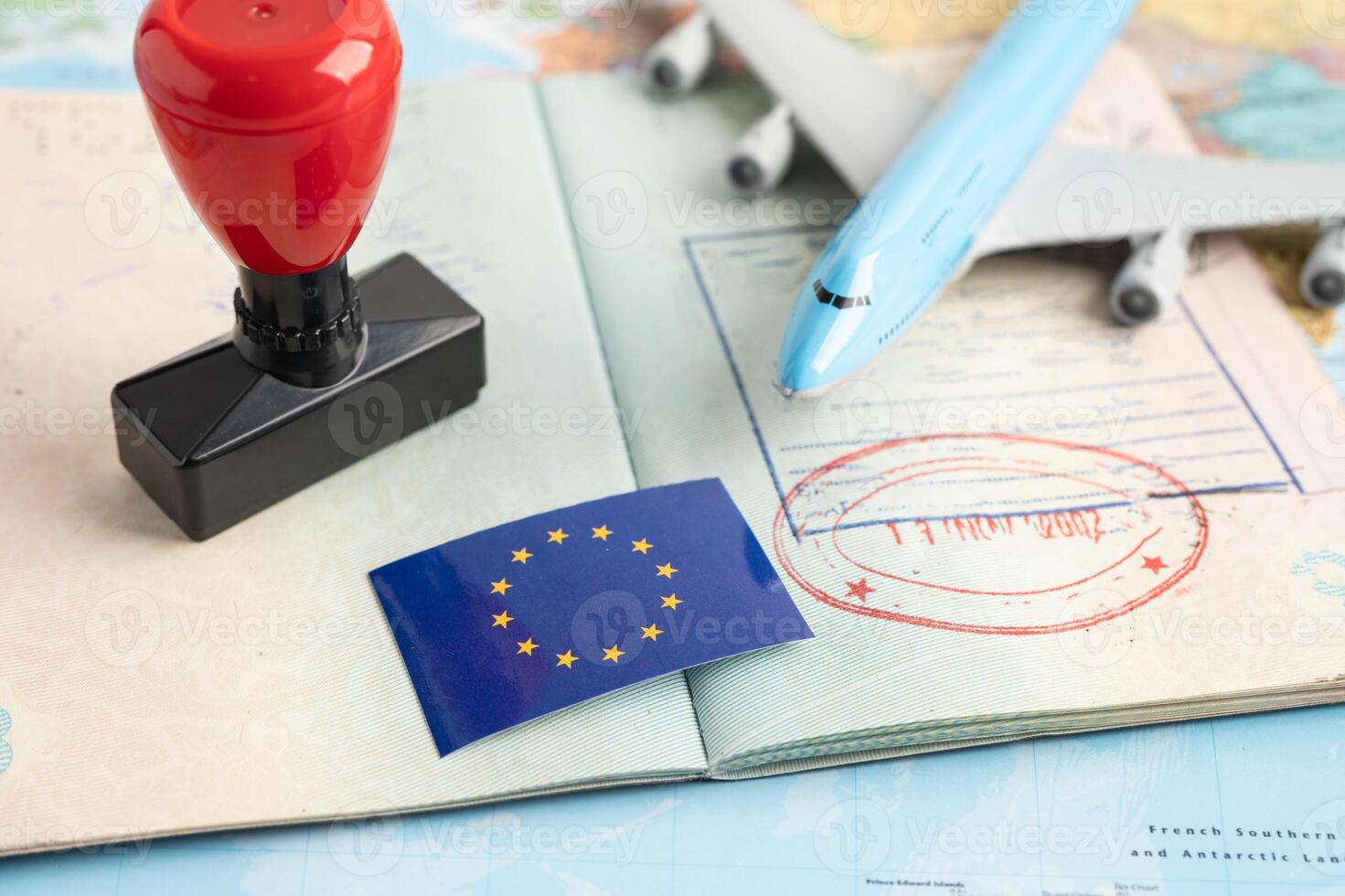 Eu flag with approved Stamp visa and passport document to immigration at airport in country. photo