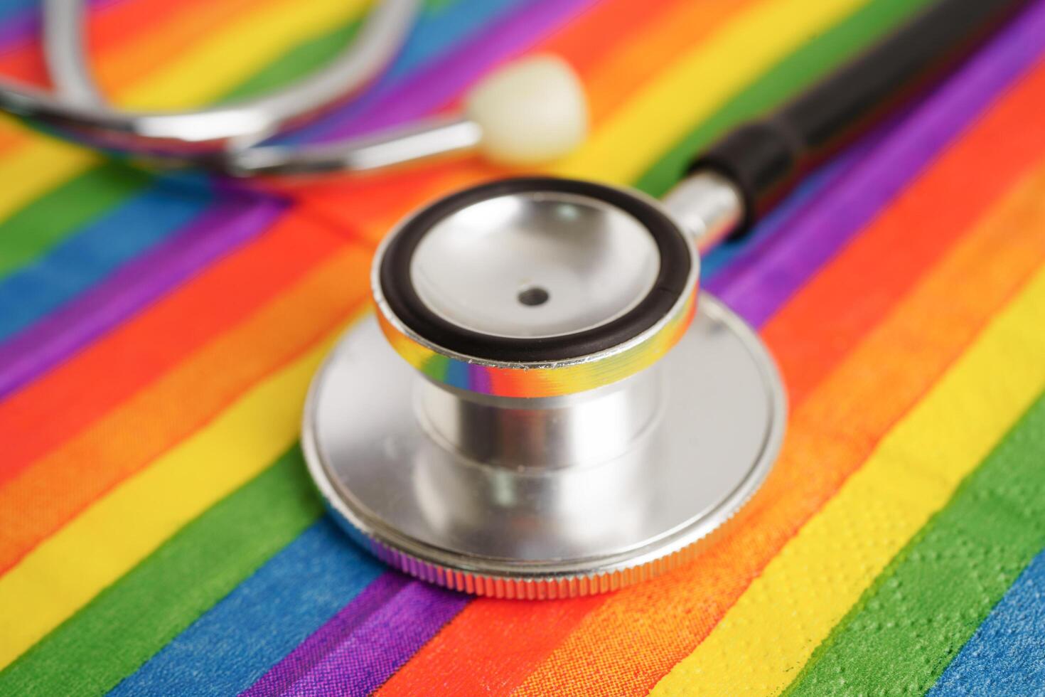 LGBT symbol, Stethoscope on rainbow flag, rights and gender equality, LGBT Pride Month in June. photo