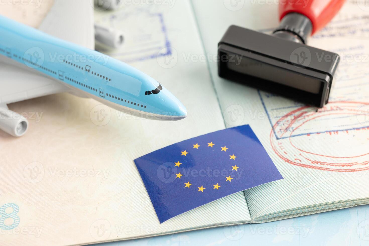 Eu flag with approved Stamp visa and passport document to immigration at airport in country. photo
