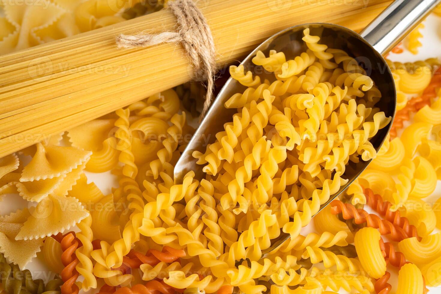 Pasta Noodles for cooking Italian food in plastic bag on white background. photo