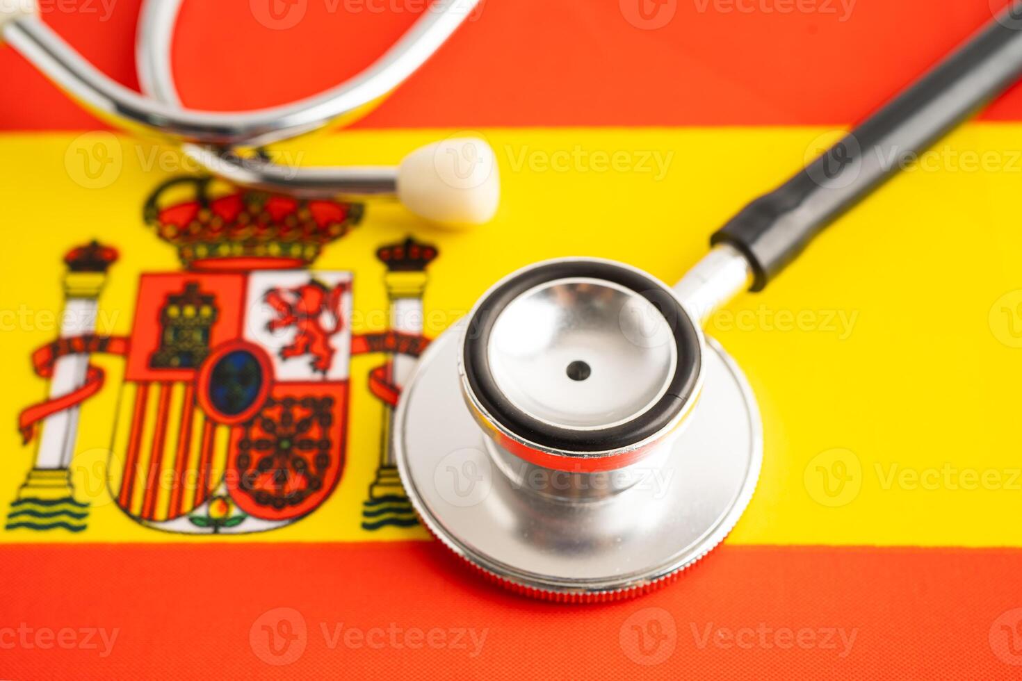Stethoscope on Spain flag, Business and finance. photo