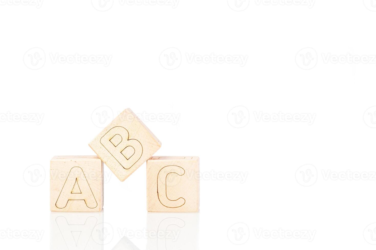 Wooden cubes with letters ABC on a white background photo