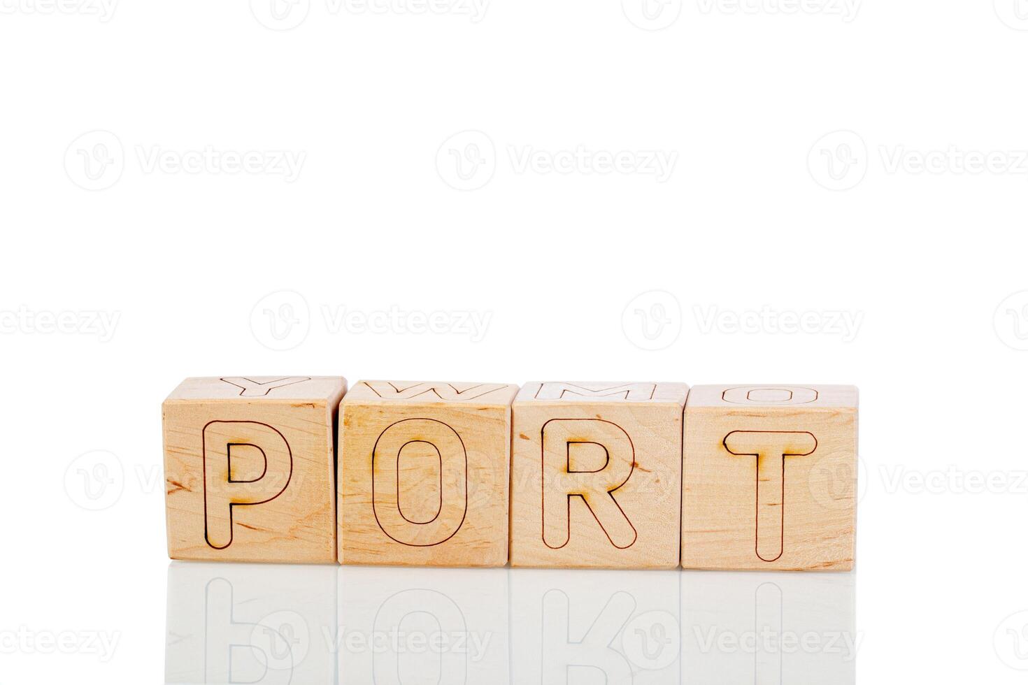Wooden cubes with letters port on a white background photo