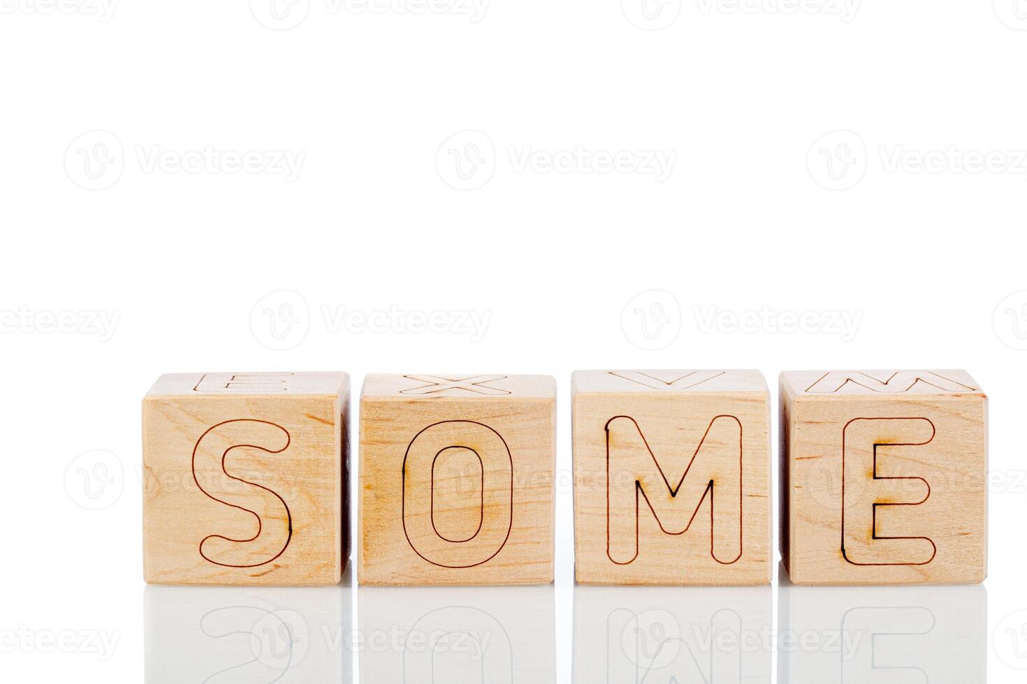 Wooden cubes with letters some on a white background photo