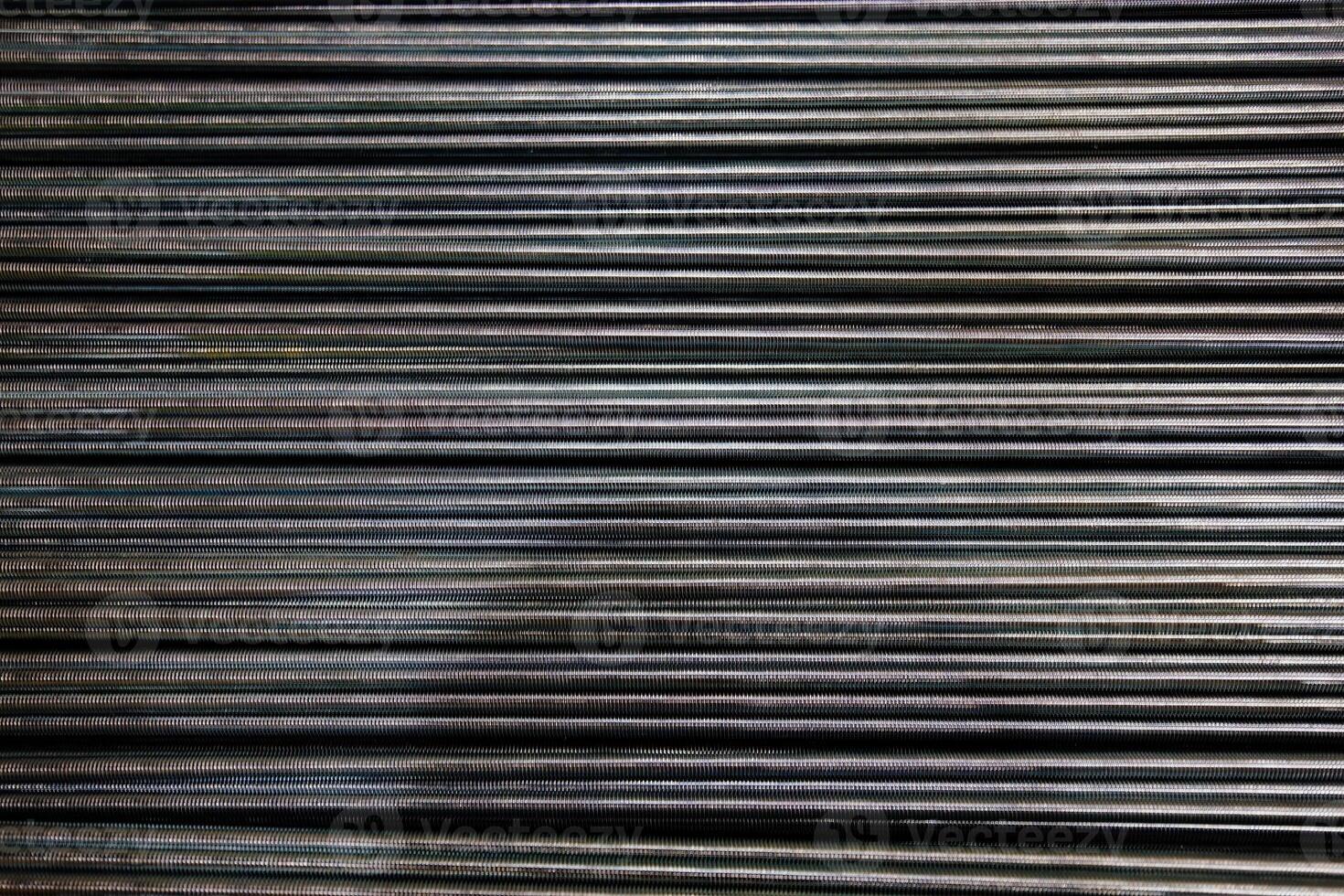 Group of threaded steel rods, abstract background photo