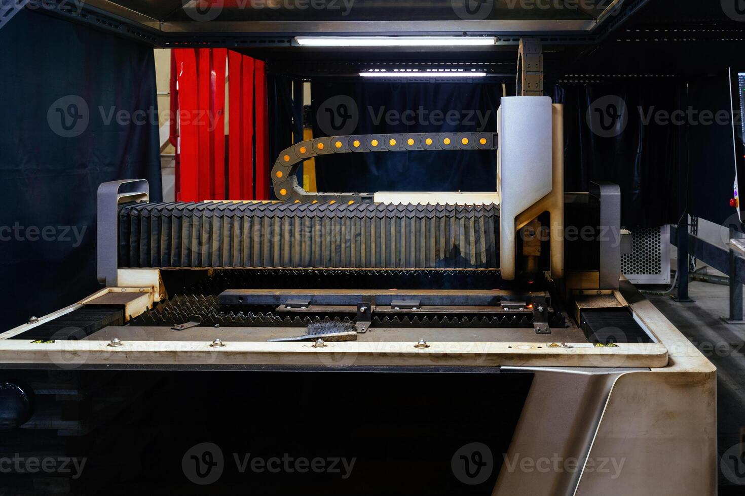 Laser cutting machine with CNC is cutting the steel sheet photo