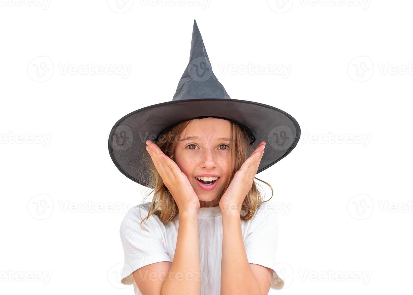 Child in witch hat looks surprised isolated photo