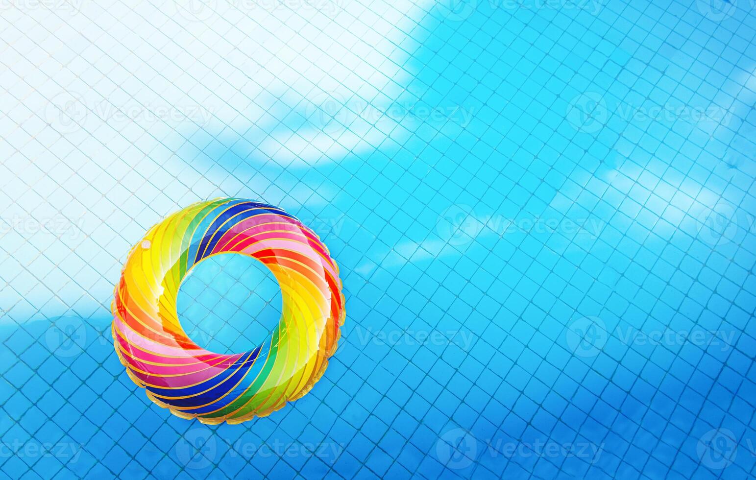 Inflatable ring in the pool water. Vacation background photo