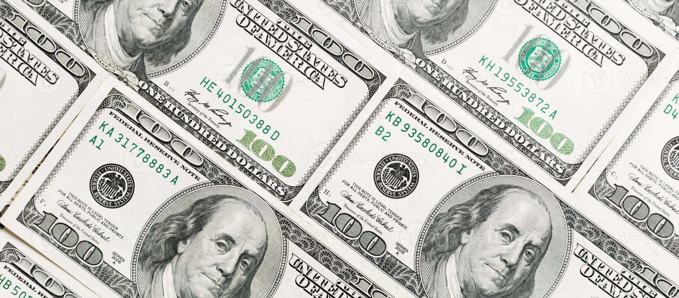 Close up of 100 dollar bills as a background. Amarican dollars pattern. Top view of business concept photo