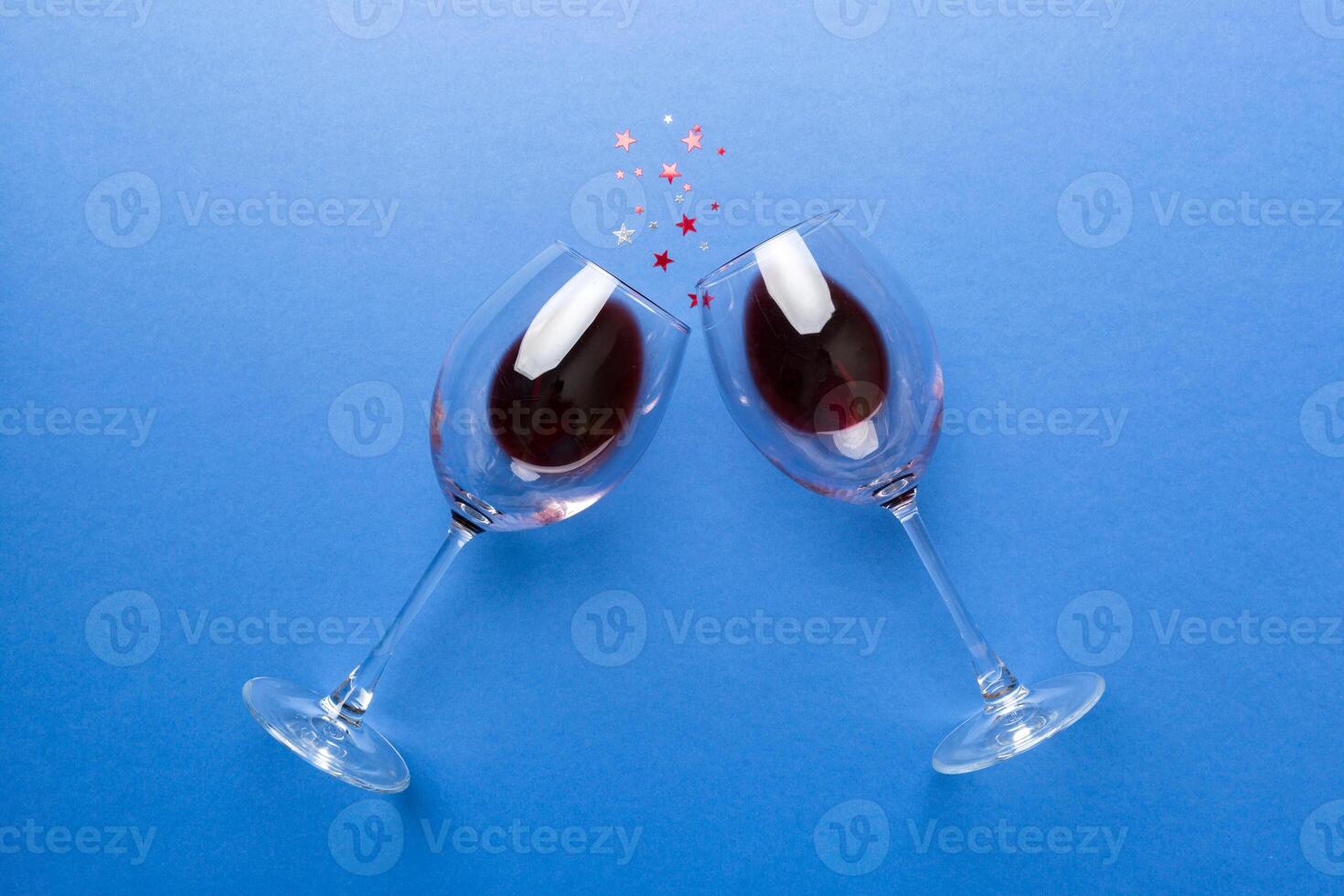 Many glasses of red wine at wine tasting. Concept of red wine on colored background. Top view, flat lay design photo