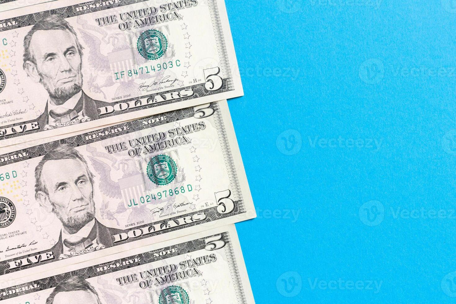 five dollar bills Top view of business concept on background with copy space photo