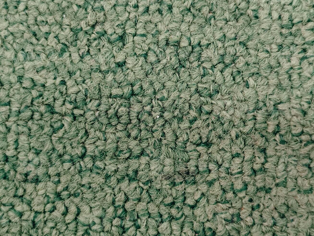 Close-up of Green Carpet Texture, Perfect for Background or Design Projects photo
