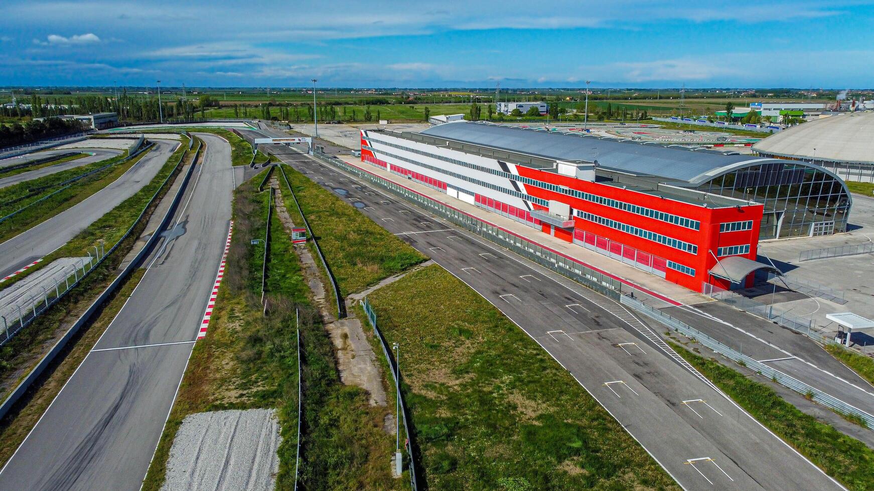 Adria racing circuit in Italy. Track abandoned for a few years where many cars and motorbikes raced. Current topic aerial view. photo