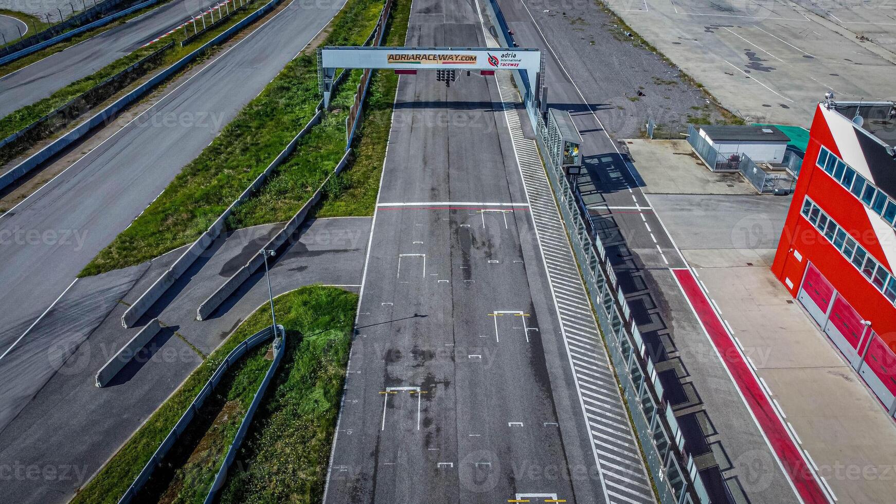 Adria racing circuit in Italy. Track abandoned for a few years where many cars and motorbikes raced. Current topic aerial view. photo
