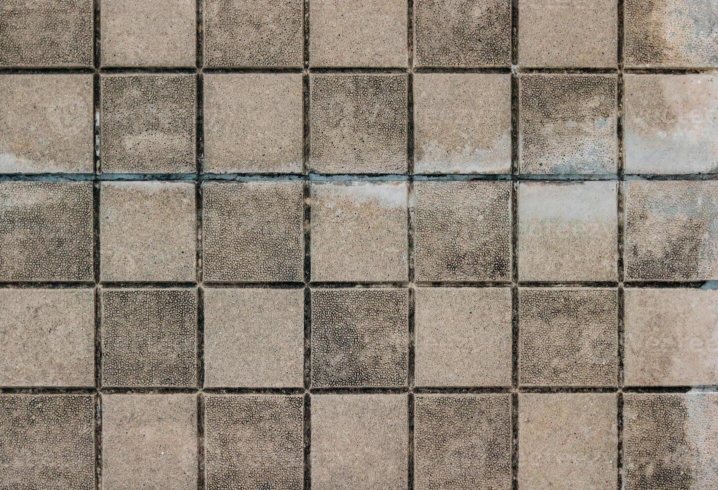 Background of old dirty concrete tile floor pattern texture. Abstract background and texture for design. photo