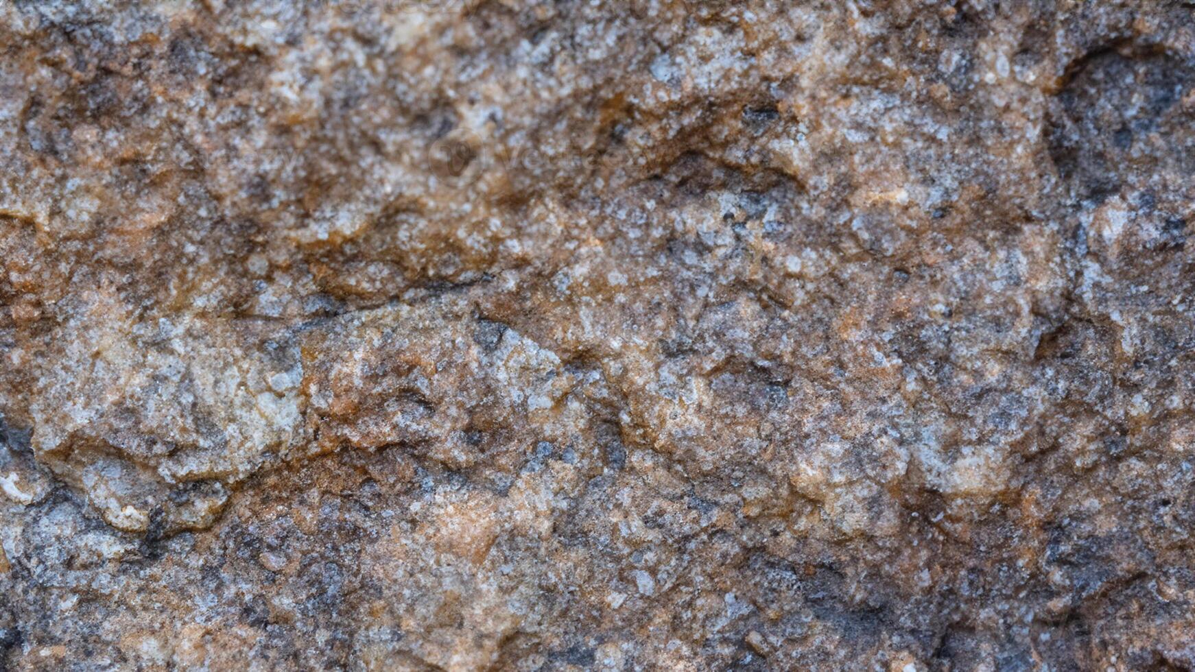This Rough-Hewn Stone Texture Captures Nature's Rugged Beauty. photo