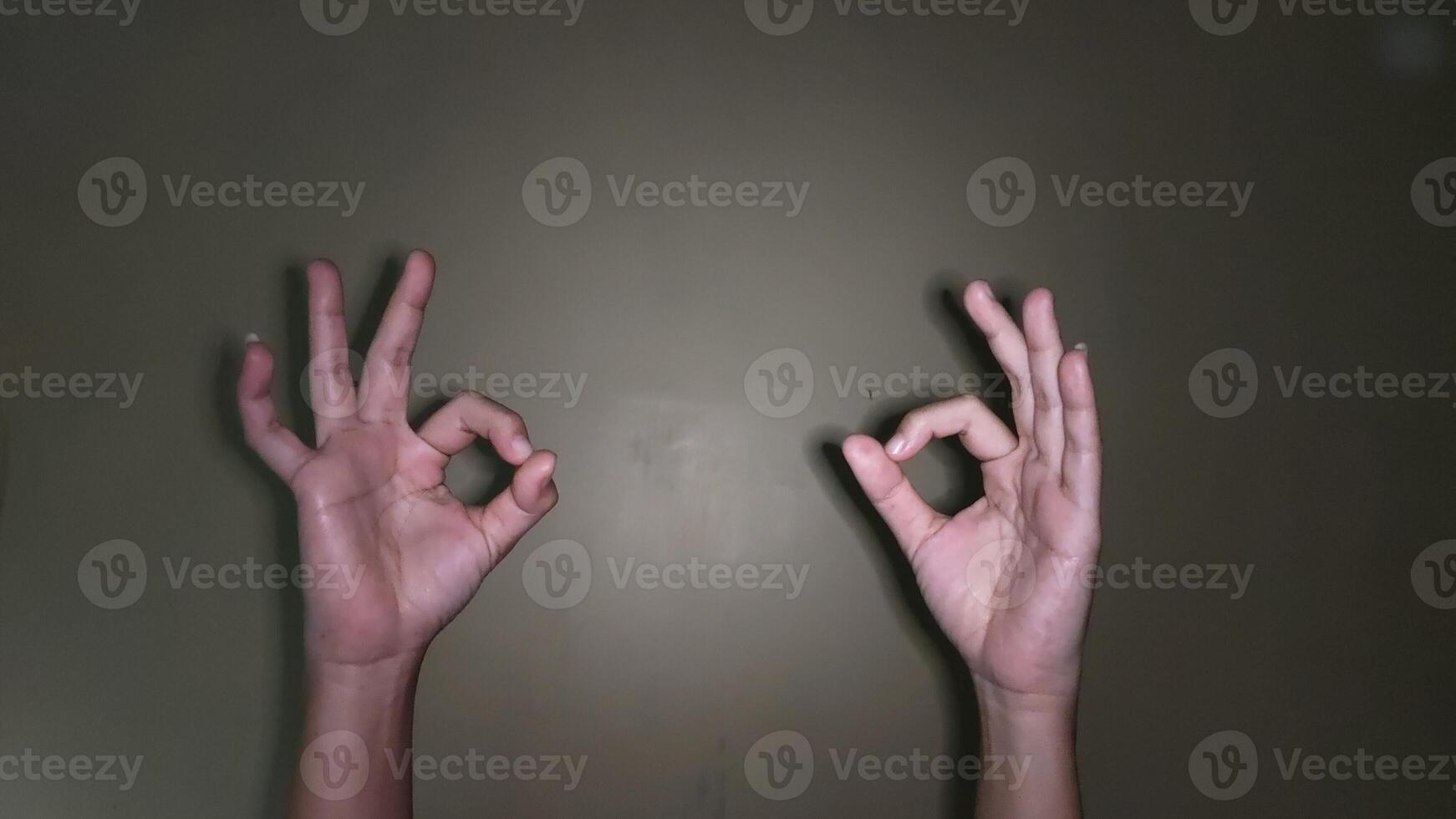 Raise two hands with an ok symbol gesture photo
