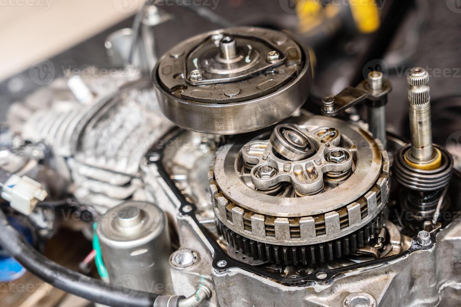 Close-up of different components of old Motorcycle clutch ,Alternating layers of fiber friction disc and steel clutch plates clamped together the Pressure Plate photo