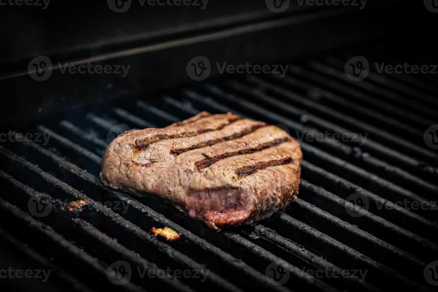 Juicy steak Meat Roasted BBQ Grill. Steak beef Grilled On Hot Barbecue Charcoal Flaming Grill. Grill Dish Closeup View. photo