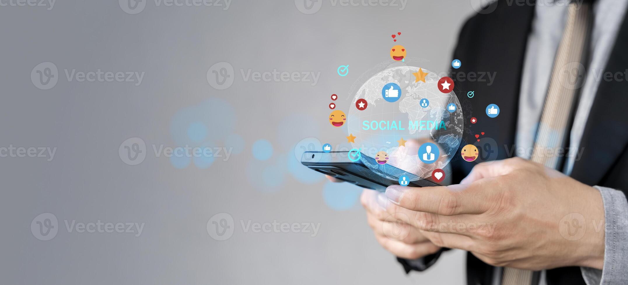 Social media and digital online communication concept, man using smartphone with likes icons on social media. photo