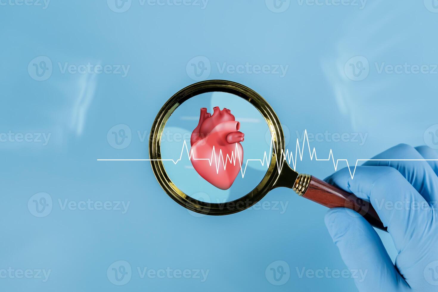 Doctor hand holding magnifying glass focus heartbeat icon on blue background for checking the function of the patient heart. photo