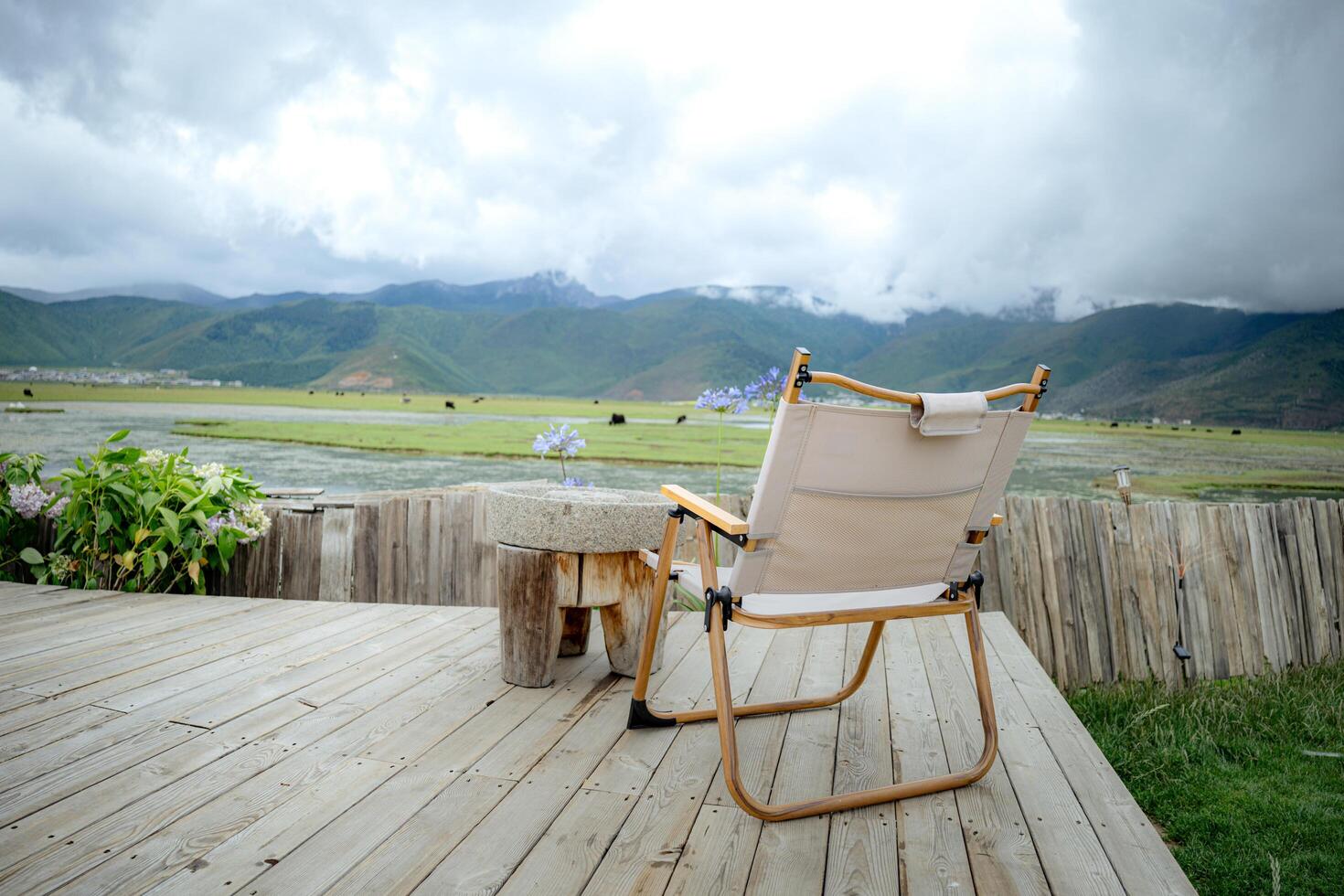 Empty table and chairs with beautiful lake and mountains view, landscape concept. photo