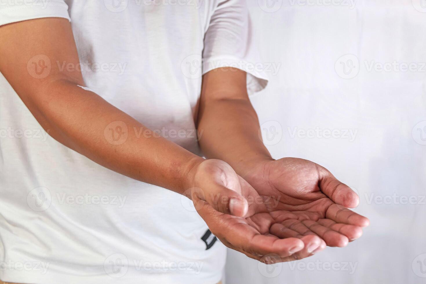 showing something by opening both palms photo