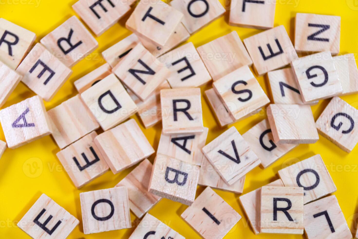 yellow background with wooden alphabet photo