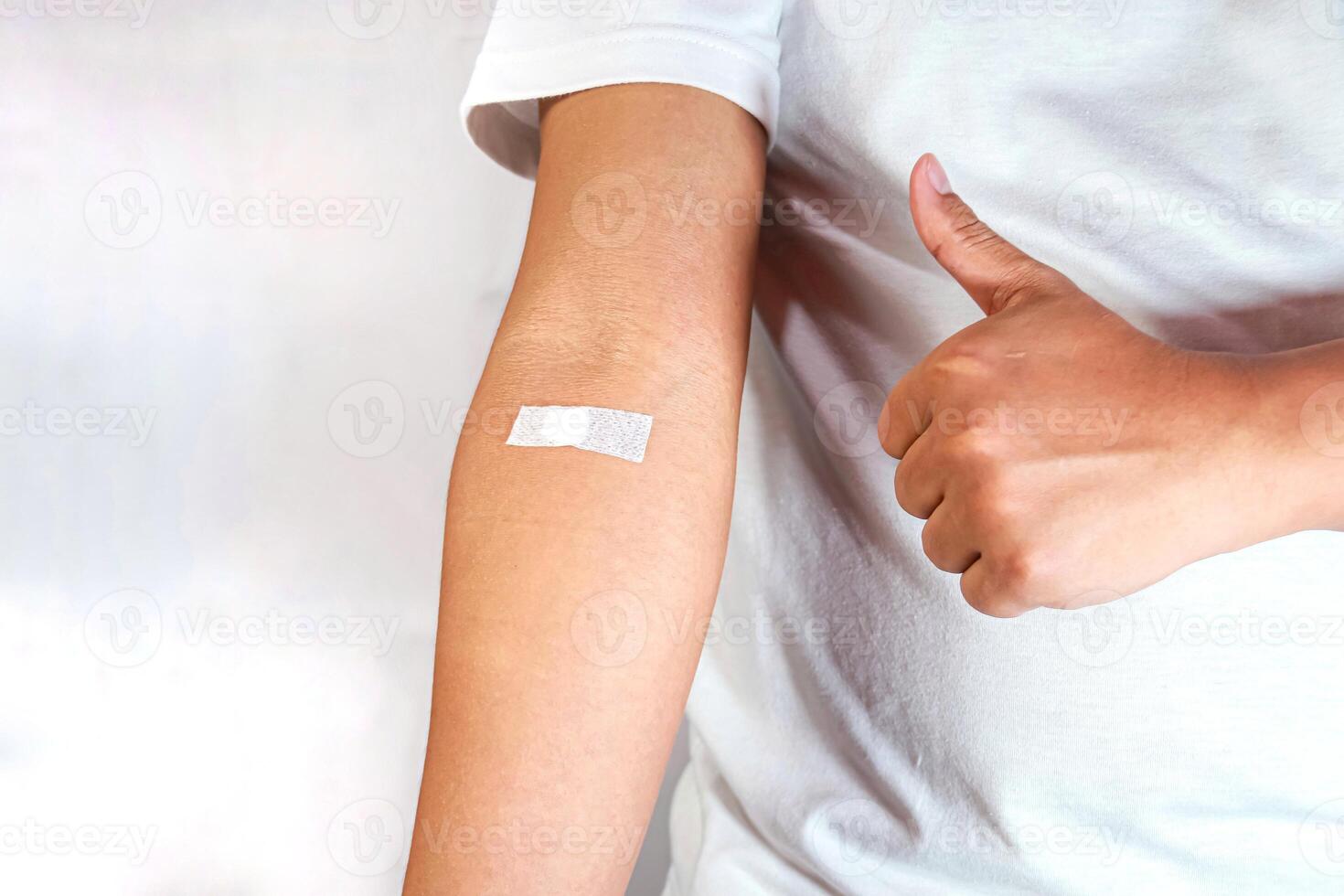 hand shows arm with injection marks and giving thumb up photo
