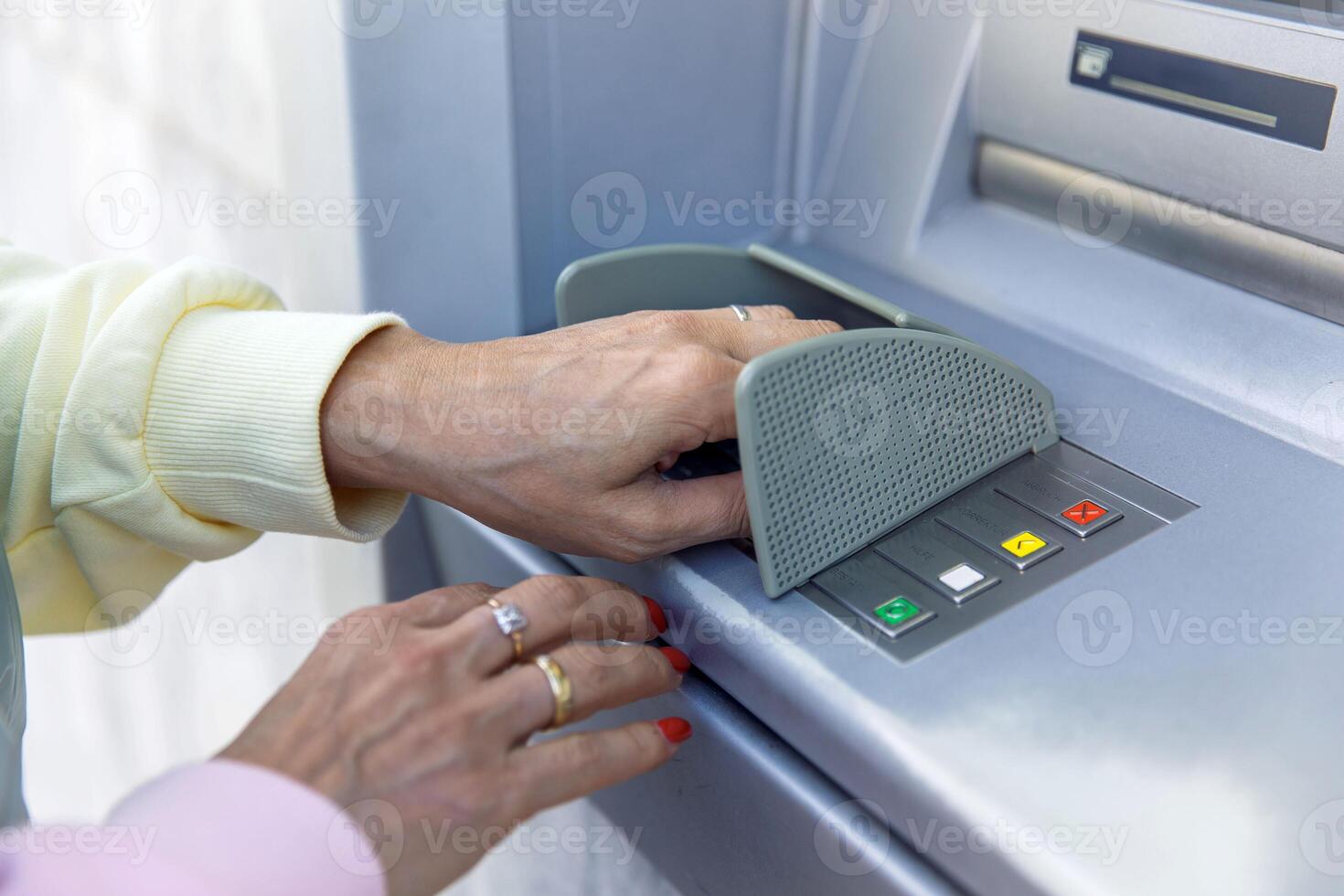 Woman using atm for cash withdrawal secure banking transaction photo