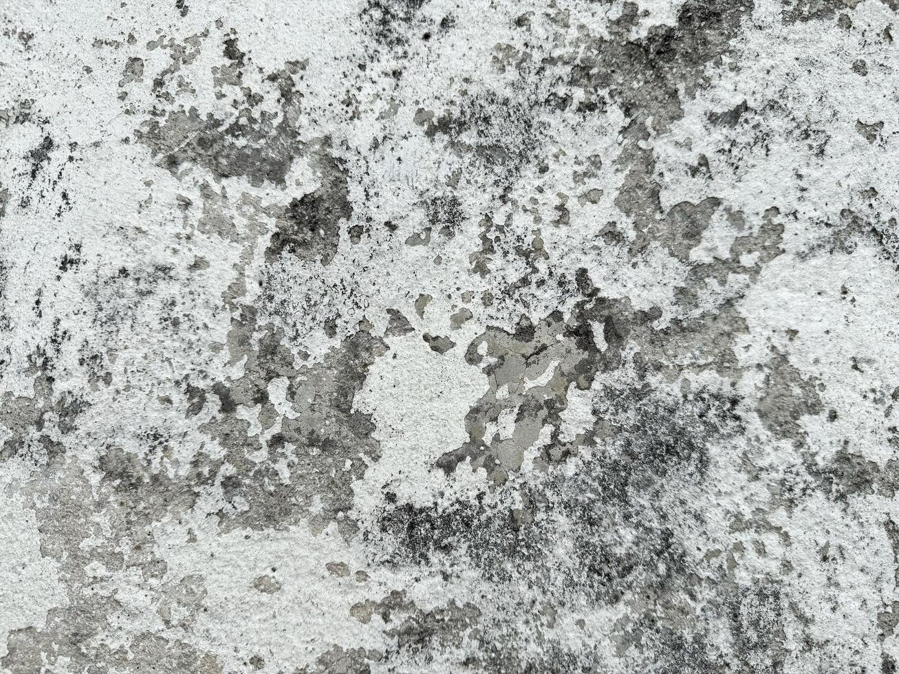 Weathered wall texture with gray and white patterns photo