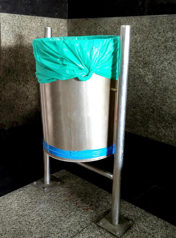 Trash dust bin at Indian railway platform photo
