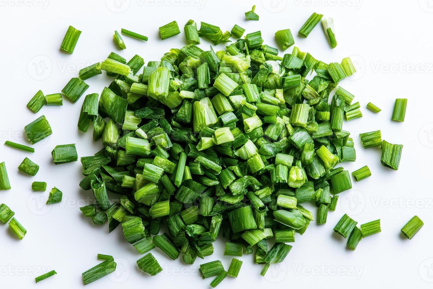 Chopped green onions on a white background, ready for culinary use. photo