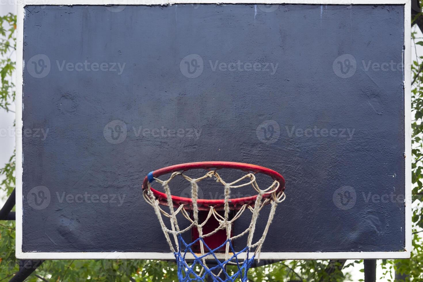 Basketball backboard with hoop basket on school playground photo