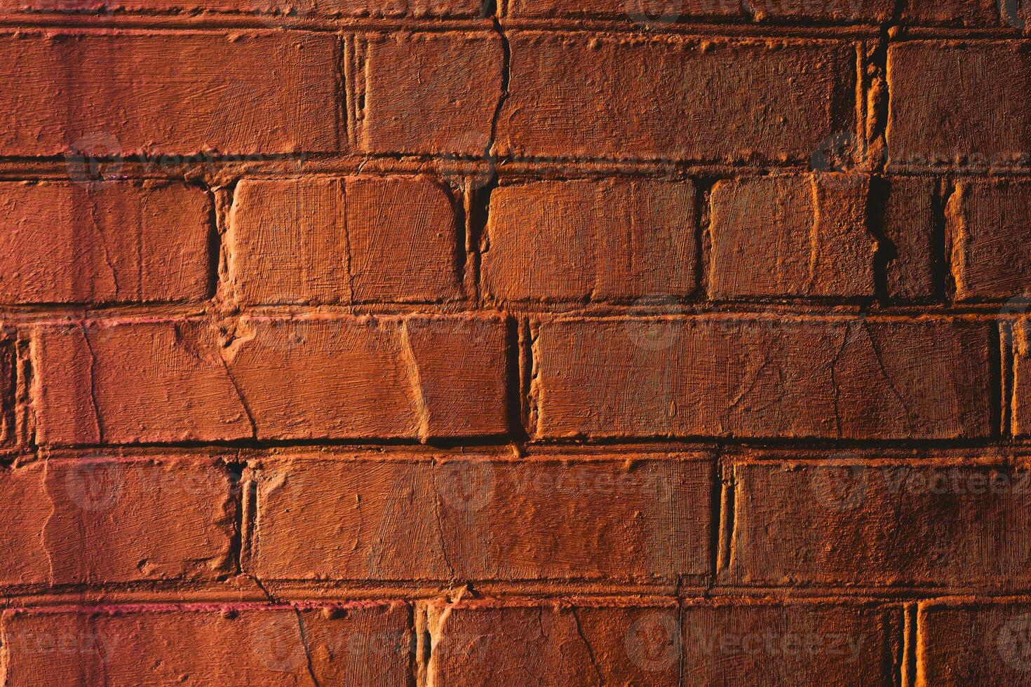 Just orange brick wall for background with shadows photo