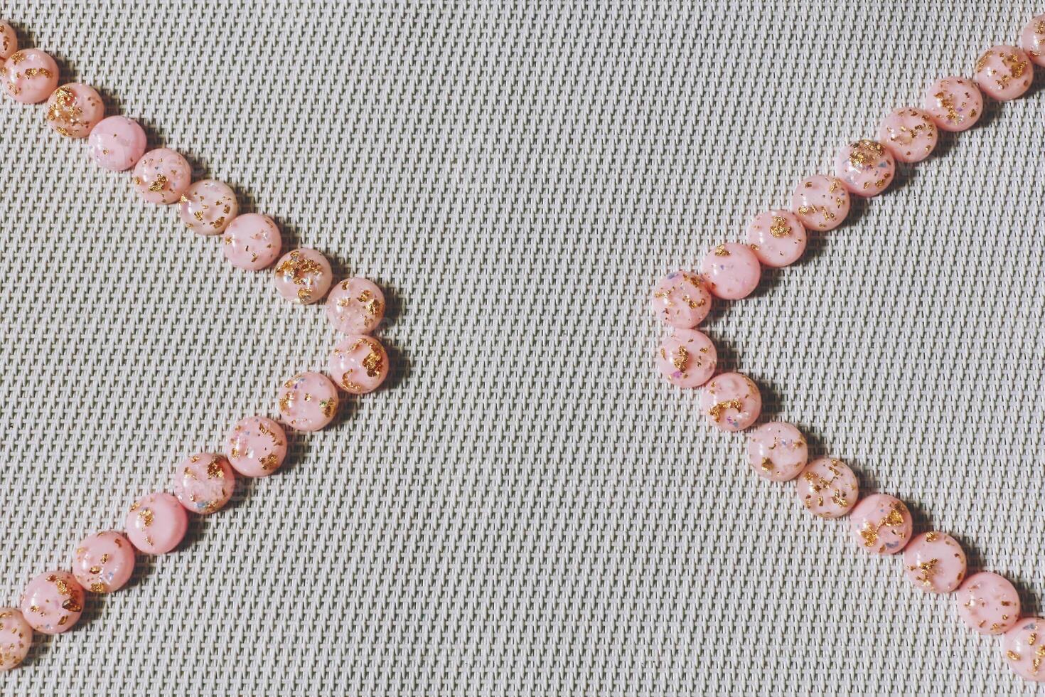 Linen fabric with a pink framed corner by balls photo
