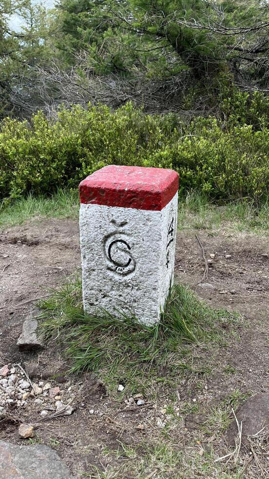 A border post on the border between Poland and the Czech Republic in the Sudeten Mountains. photo