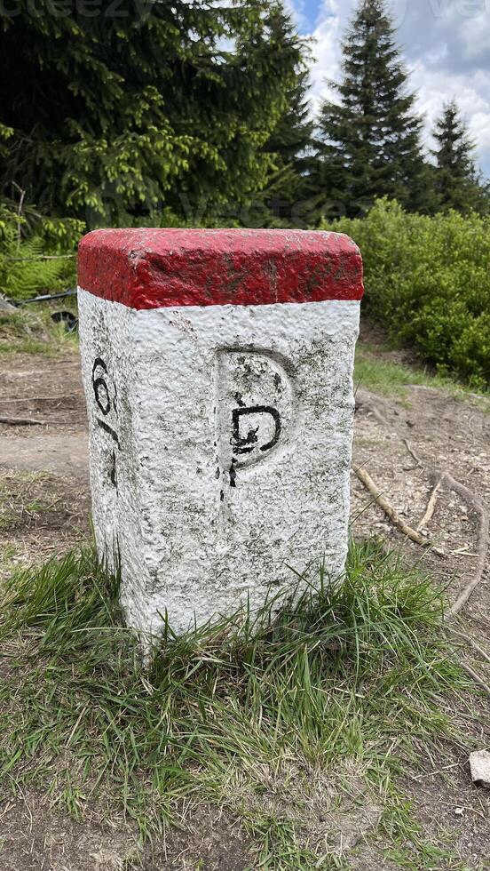A border post on the border between Poland and the Czech Republic in the Sudeten Mountains. photo